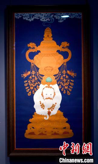 圖為5月16日，展覽中的新創(chuàng)唐卡作品《瑞象承香》?！±盍?攝